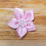 Ribbon flower with pearl centre