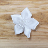 Ribbon flower with pearl centre